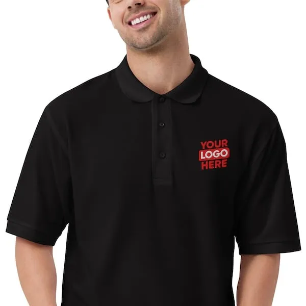 Happy man wearing a corporate polo shirt that has been embroidered with a company logo to represent products available in Boston and the surrounding Beantown.